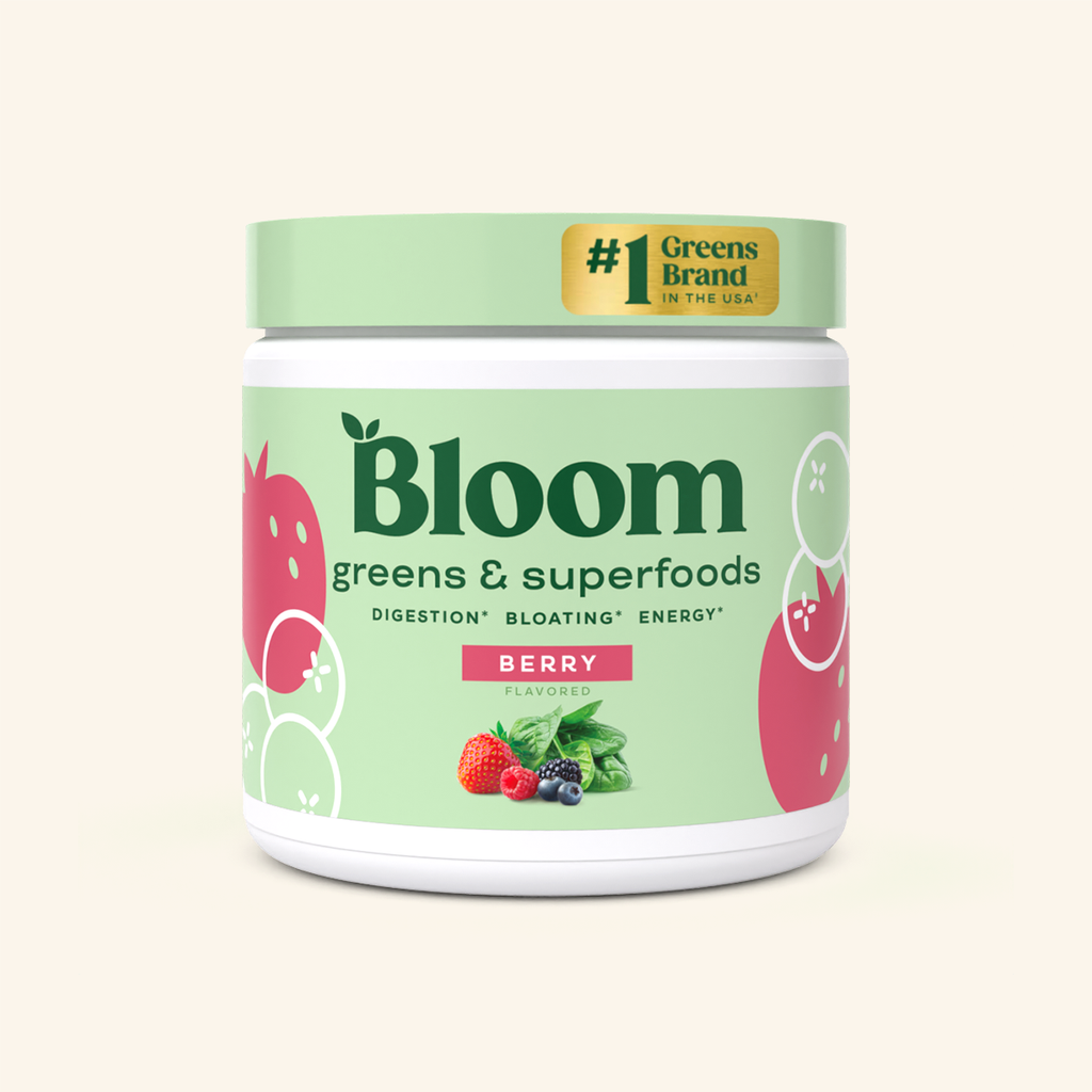A container of Bloom greens & superfoods powder in Berry flavor, labeled as supporting digestion, bloating, and energy. 30 servings.