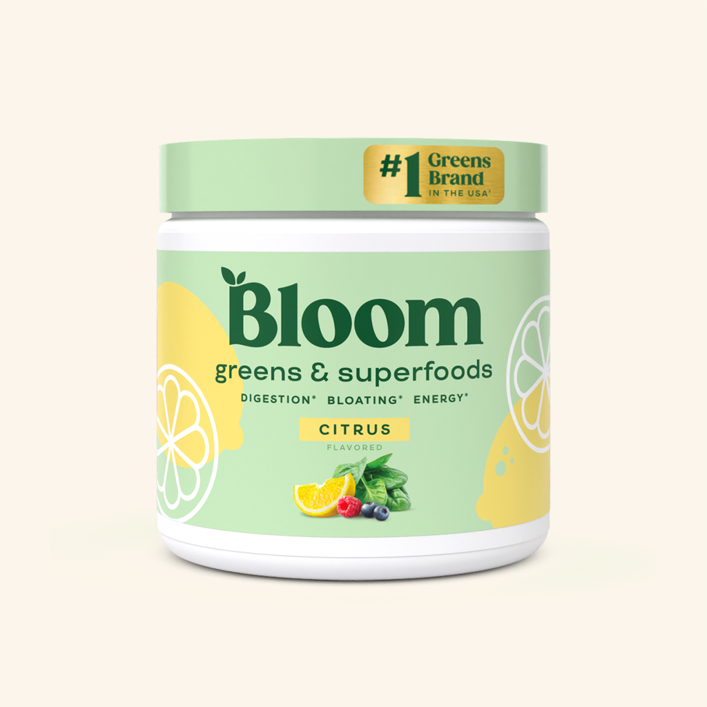 A container of Bloom greens & superfoods powder in Citrus flavor, labeled as supporting digestion, bloating, and energy. 30 servings.