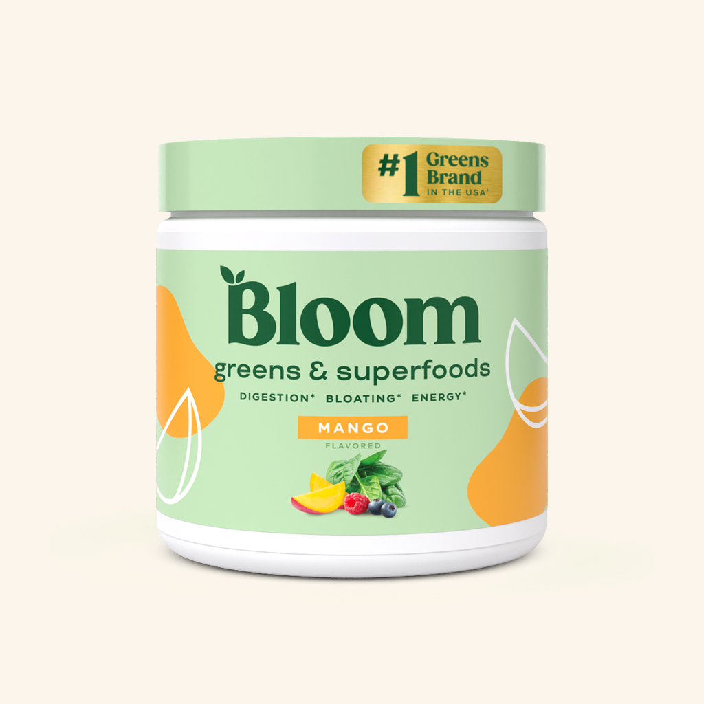 A container of Bloom greens & superfoods powder in Mango flavor, labeled as supporting digestion, bloating, and energy. 30 servings. #1 Greens brand in the USA.