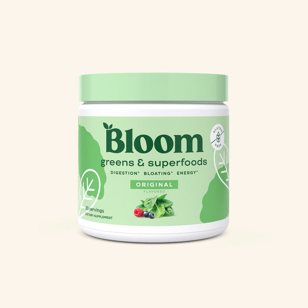 A container of Bloom greens & superfoods powder in the original flavor released, labeled as supporting digestion, bloating, and energy. 30 servings.