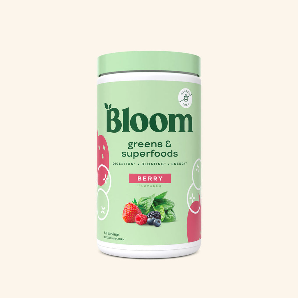 A container of Bloom greens & superfoods powder in Berry flavor, labeled as supporting digestion, bloating, and energy. 60 scoop servings.
