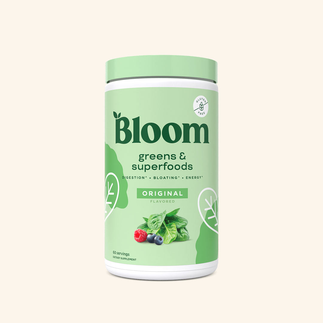 A container of Bloom greens & superfoods powder in Original flavor, labeled as supporting digestion, bloating, and energy. 60 servings.